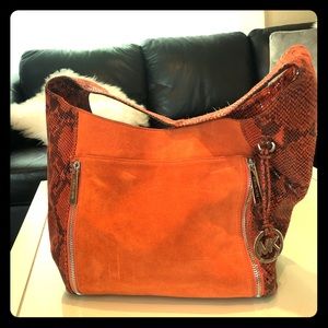 Michael Kors leather hobo handbag.